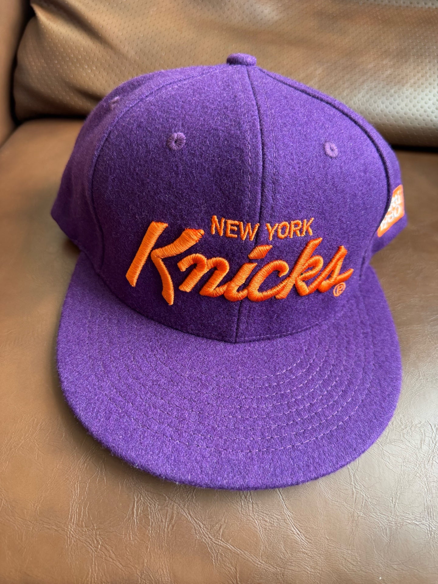 New York Knicks Vintage Recreation Baseball Cap - flat lay on couch